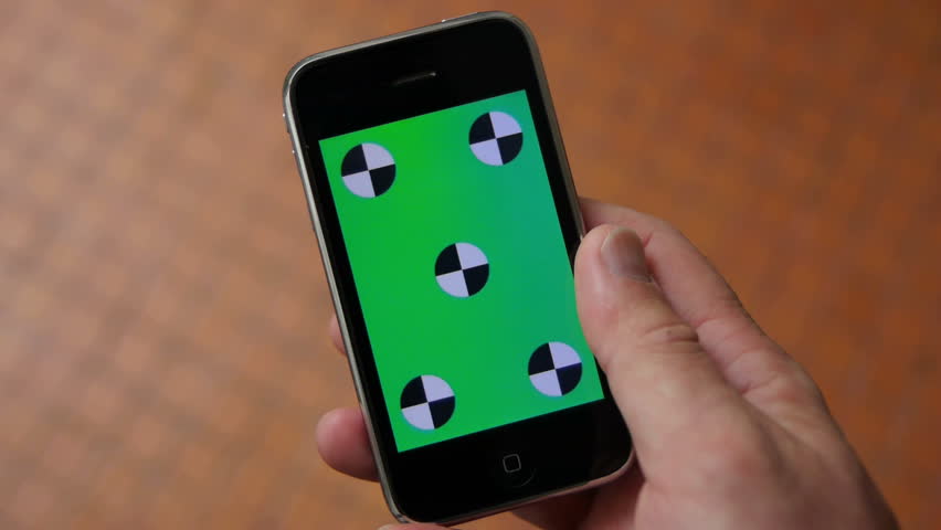 Smart Phone held by hands. Green screen Chroma Key. Close up. Tracking motion. Vertical.
