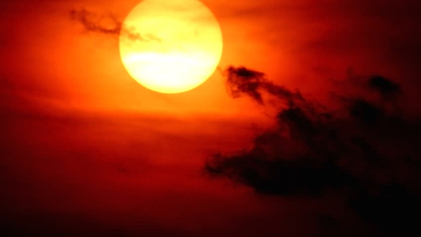  Sun falling on the red cloudy sky.
