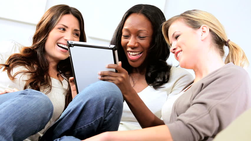 Multi ethnic pretty girls online dating on tablet computer