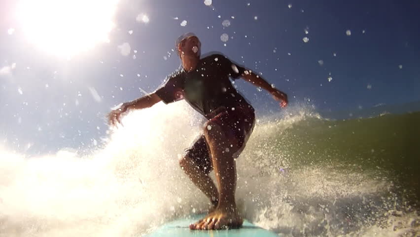 A man surfing in the warm water's of Central America