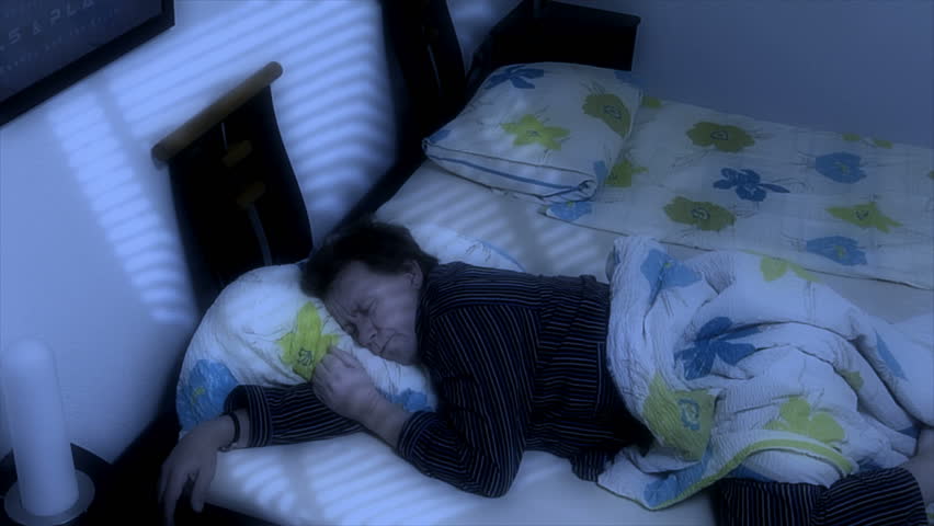 A man can not sleep. He looks at his cell phone in the night. 10662 
