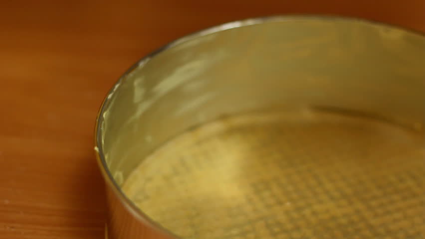 Making Chocolate Sponge Cake. Series. Placing chocolate batter into springform.