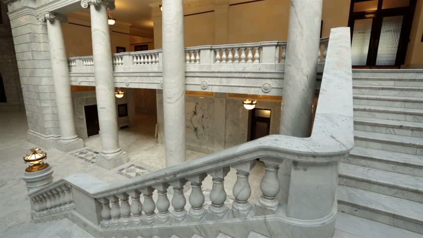 Utah State Capital pan across stairs rotunda. Capitol building high on a hill overlooking the city of Salt Lake City. Elegant architectural interior design made from granite and copper outer dome. 
