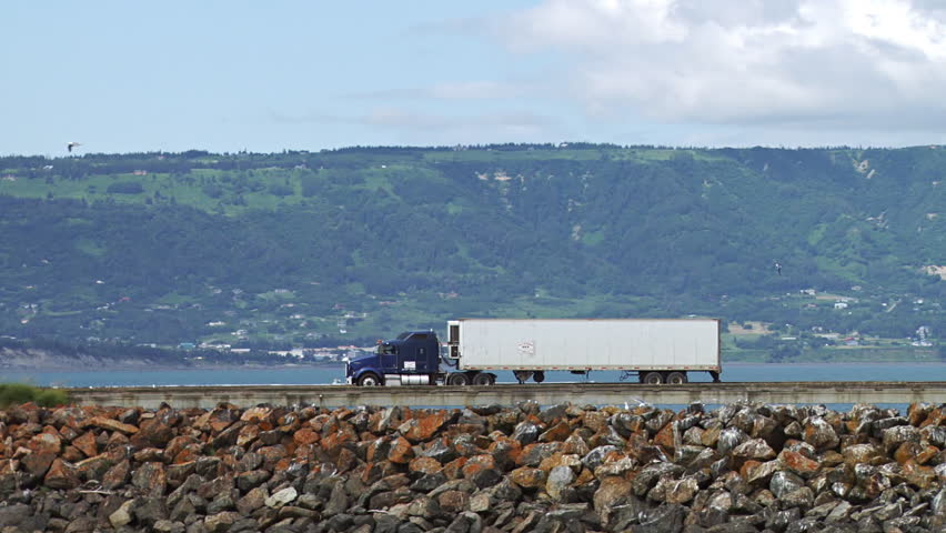 Semi Truck Hauling Goods and Fish From Dock