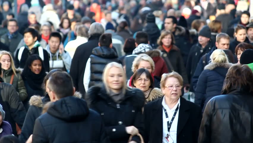 STUTTGART, GERMANY - DECEMBER 1: A crowd of people walking in the Stuttgart Christmas Market on December 1, 2012 in Stuttgart, Germany.  The Stuttgart Christmas Market is one of the largest in Europe.