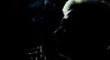 Full HD slow motion - silhouette of a punk girl smoking - filmed with 35mm camera! No noise, no aliasing issues, no banding etc. Two shoots! 
