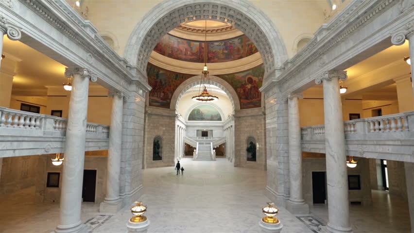 SALT LAKE CITY, UTAH NOV 2012: Father son walk Utah State Capital rotunda to learn about government. Utah State capital building overlooking city Salt Lake City. Elegant architectural interior design.