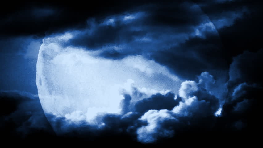 Full moon with dramatic time lapse clouds and air distortion. 