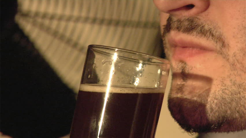 man drink dark beer