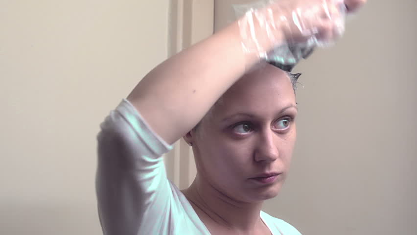 Sony FS-100 - Young woman doing her hair with dye!