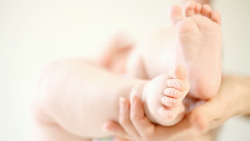 Baby feet on the light background