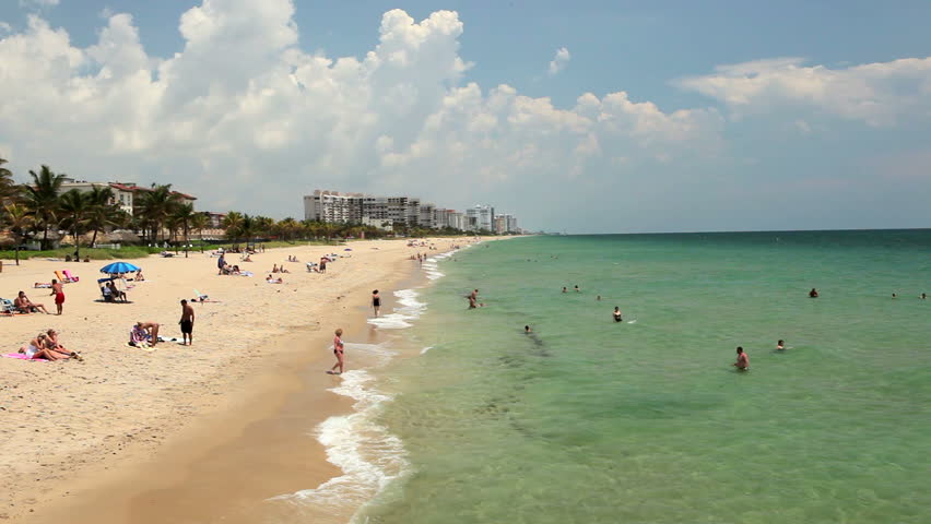 FT. LAUDERDALE, FLORIDA - CIRCA OCT 2010: View of beach area in Ft. Lauderdale, Florida from Anglins Fishing Pier. People enjoying the surf and sand beach in tourist area.