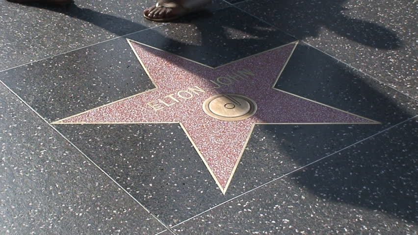 HOLLYWOOD, LOS ANGELES - CIRCA 2009: Tourists walking on Hollywood Walk of Fame in Hollywood, California. 