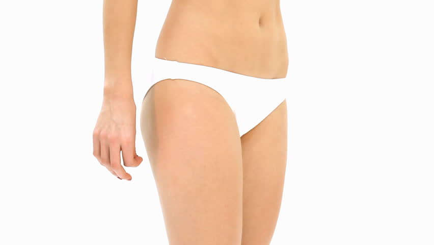 woman analyzing cellulite on her buttocks
