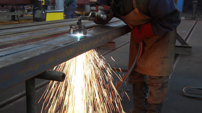 Steel Workers welding, grinding, cutting in metal industry