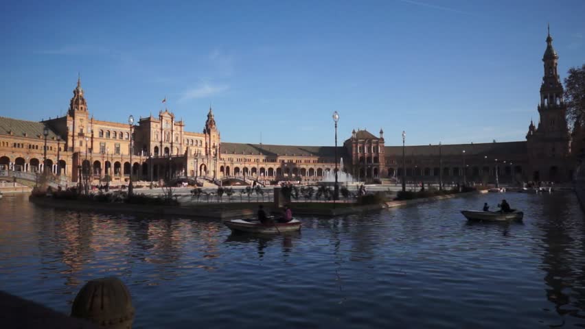 SEVILLE, SPAIN - JANUARY 6: Tourists enjoy a trip on boat on Plaza de Espana Seville on Jan 6, 2013 It was built in 1928 for the Ibero-American Exposition of 1929 designed by architect Anibal Gonzalez