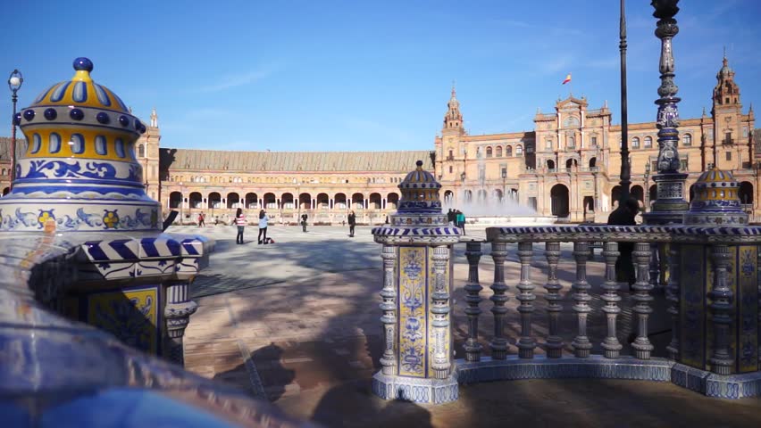 SEVILLE, SPAIN - JANUARY 6: Tourists enjoy a trip on Plaza de Espana Seville on Jan 6, 2013 It was built in 1928 for the Ibero-American Exposition of 1929 designed by famous architect Anibal Gonzalez