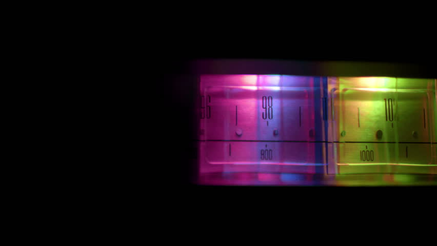 a glowing radio with the marker running through the different stations and frequencies