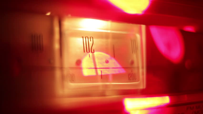 a glowing radio with the marker running through the different stations and frequencies