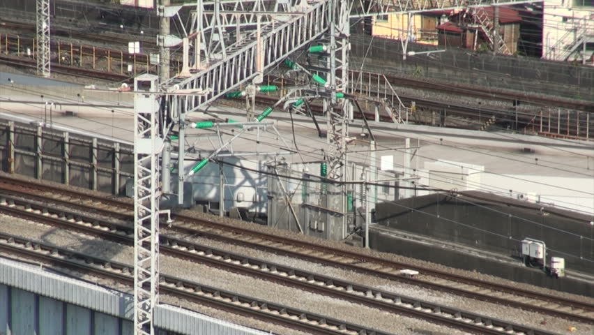 ODAWARA, JAPAN - 16 OCTOBER 2012: A Shinkansen (fast bullet train) making its way from Tokyo to Nagoya near Odawara station, Japan