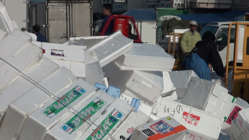 TOKYO, JAPAN - 7 NOVEMBER 2012: Workers are gathering foam boxes that are used for storing and transporting fish to recycle them, at the Tsukiji fish market in Tokyo, Japan