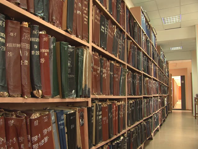 shelves with old files and folders (documents and drafts)