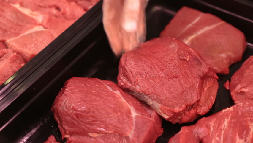 Selling a piece of meat in the store