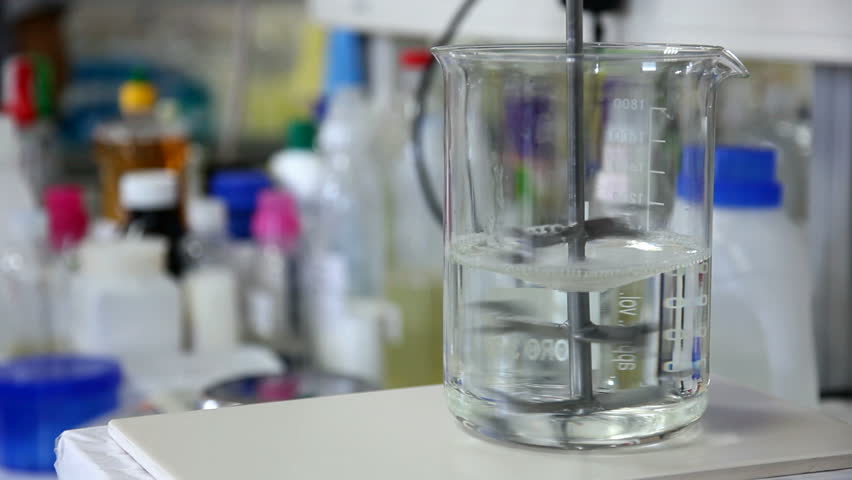 Mixing chemicals in an experiment, with lab mixer/stirrer.