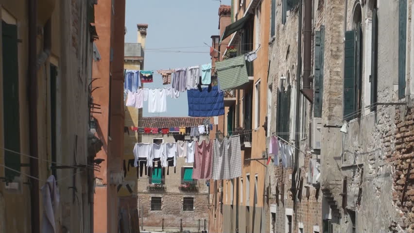 Quiet canal in Venice with wash hanging out to dry