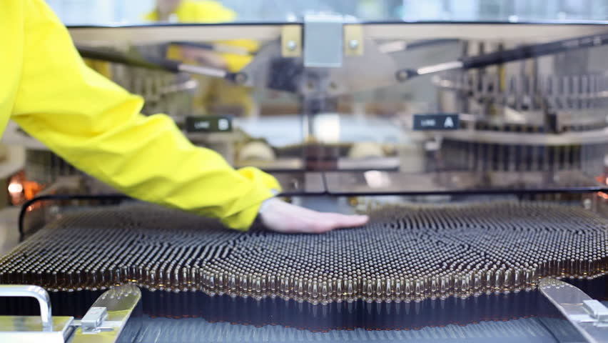 Automatic optical inspection machine, inspects vials and ampoules for particulates in liquid and container defects.