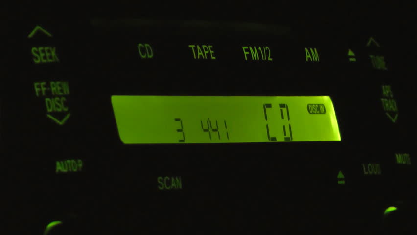 Close-up shot of carâs CD player at night