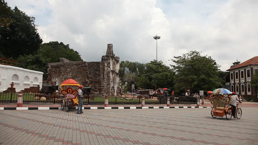 MALACCA 4 November: timelapse of trishaw driving in front of ''A Famosa'' Malacca in Malaysia on 4th November 2012