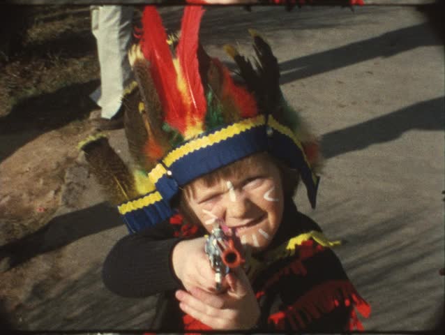 Boy aiming with toy gun (vintage 8mm)