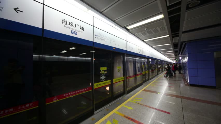 GUANGZHOU - NOV 21: Arrival of a Train at subway station Haizhu Square for glass doors on Nov 21, 2011, in Guangzhou, China. Total length of subway lines in Guangzhou is 236 km.