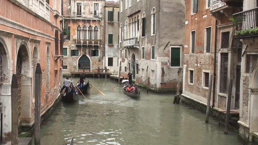 VENICE, ITALY - MAY 11: Gondolas in one of the canals in Venice on May 11, 2012. Gondolas are now mainly used for touristic purposes but where once the main form of transportation in Venice.