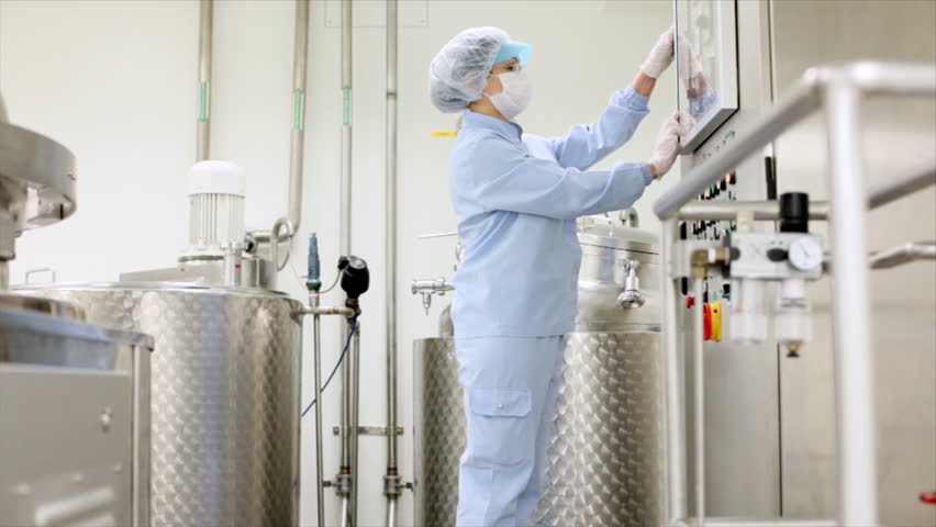 Preparing machine for work in pharmaceutical factory.