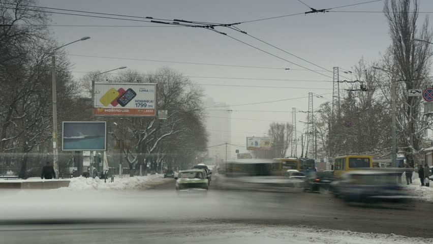 ODESSA - JANUARY 25: (TIMELAPSE) Car traffic in winter city on January 25, 2013 in Odessa, Ukraine. Odessa has the largest port in Ukraine. A major industrial, cultural and resort center
