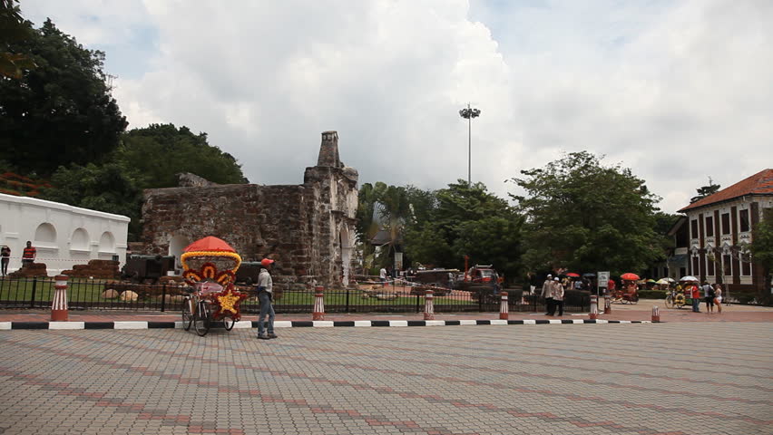 MALACCA, MALAYSIA - NOV 4: Timelapse of trishaw driving in front of A Famosa in Malacca, Malaysia on 4th November 2012