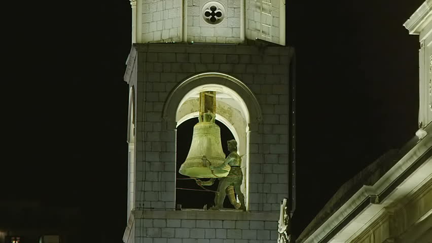 Famous Dubrovnik old city tower with clock. Two bronze statues "Maro" and "Baro" strike the bell.