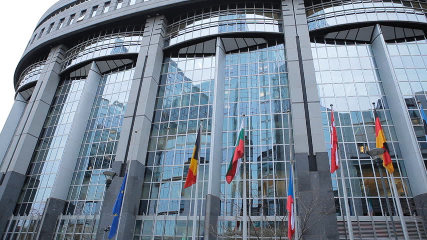 BRUSSELS, BELGIUM - DECEMBER 20: Flags in front of European Parliament Building in Brussels, Belgium on December 20, 2011.