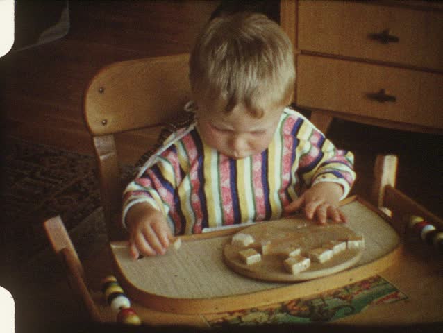 Baby eating bread (vintage 8 mm amateur film)