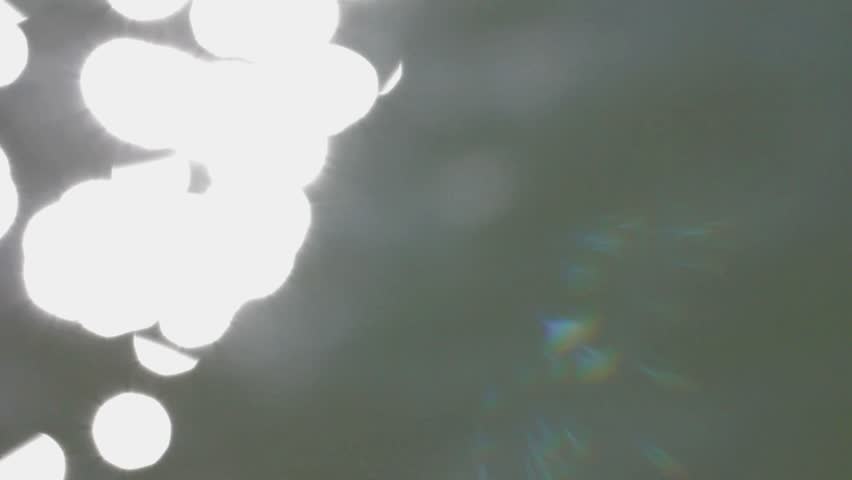 beautiful bokeh from the rays of the sun on the water