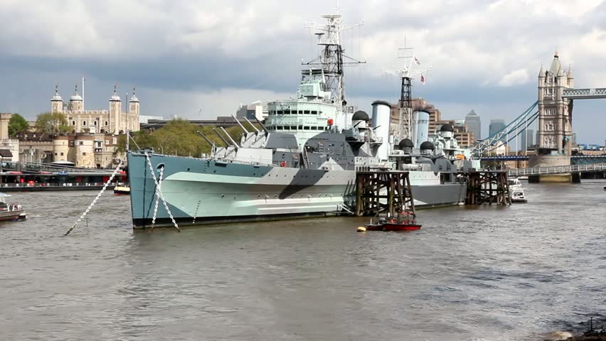 London, England - famous historic ship, HMS Belfast. Light cruiser navy vessel moored in Thames River.