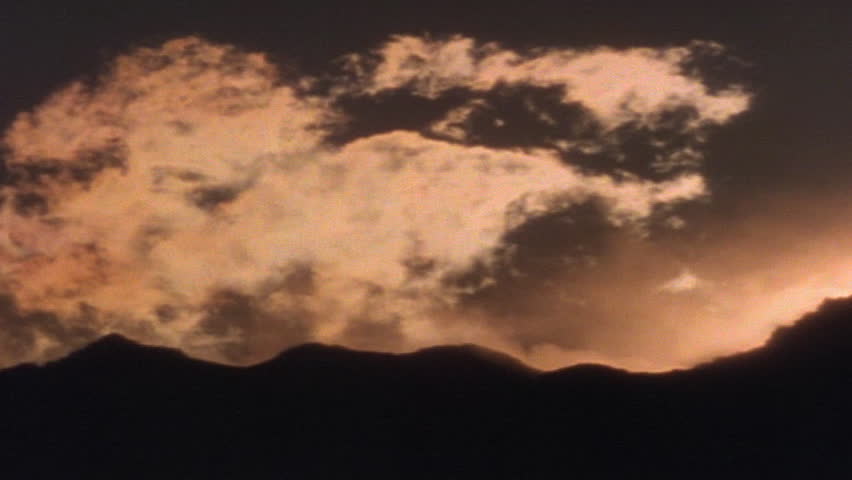 Silhouetted horizon as dawn breaks 