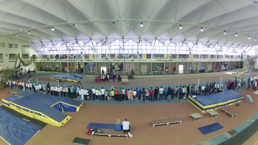 Lined up children on sprint track. Timelapse