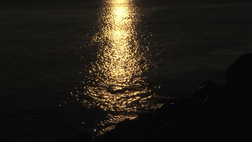 Golden sunlight path reflection on sea 