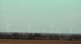 Wind turbine farm on blue sky