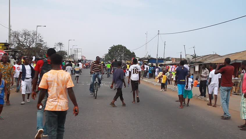 ACCRA, GHANA - CIRCA DEC 2012: People in the street during the Homowo Festival in Accra, Ghana circa December 2012. Celebrated by the Ga people in remembrance of a historical famine.