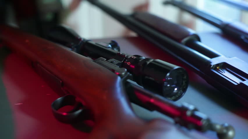 Guns at a gun show. 
Studio area, fake setup