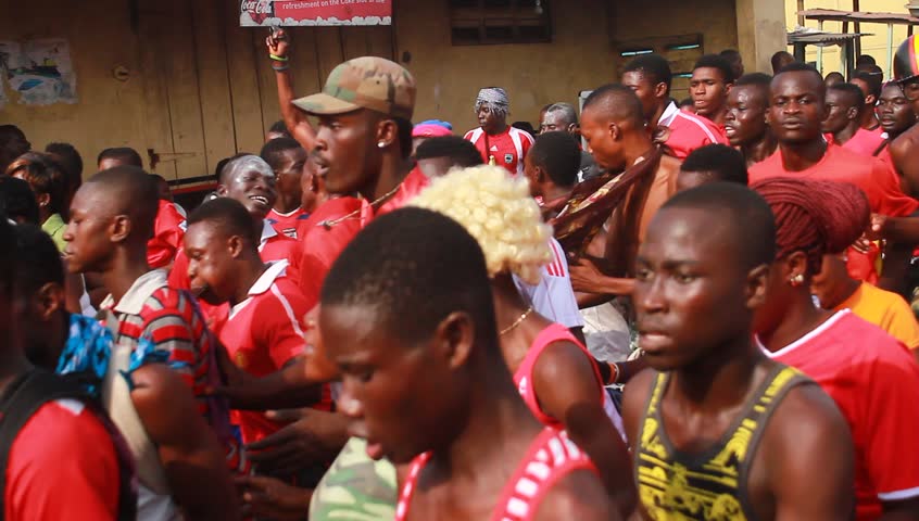 ACCRA, GHANA - CIRCA DEC 2012: People in the street during the Homowo Festival in Accra, Ghana circa December 2012. Celebrated by the Ga people in remembrance of a historical famine.